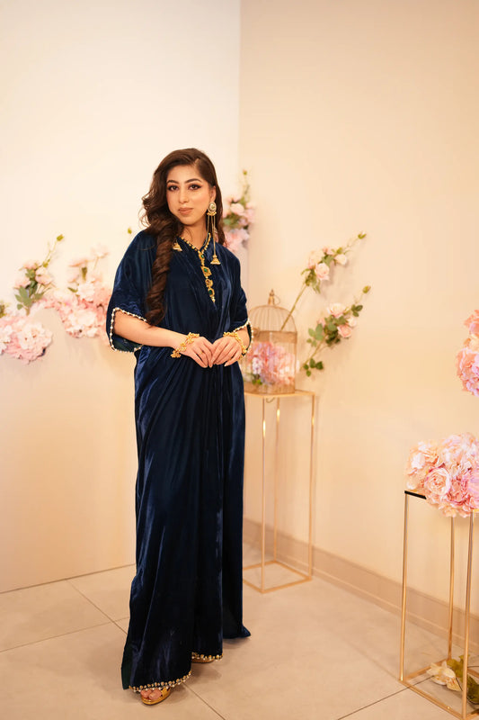 Navy blue velvet kaftan with V neckline cinched waist and embellishment