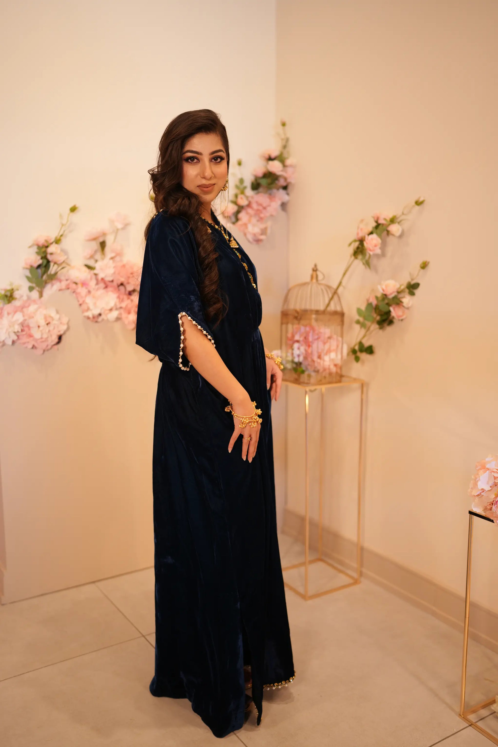 Navy blue velvet kaftan with V neckline cinched waist and embellishment